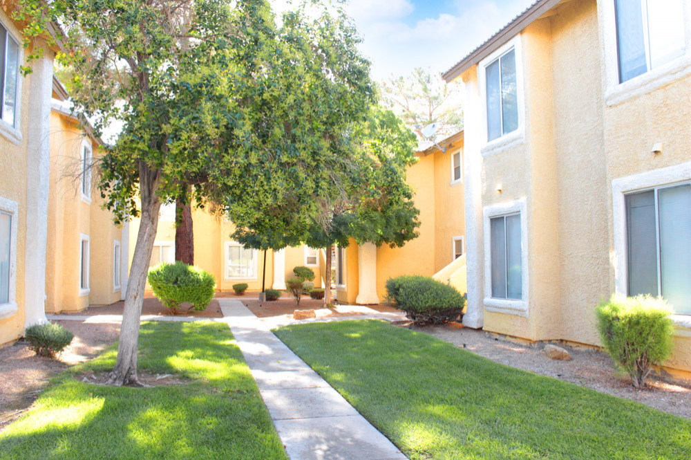 Exterior photo of Sunset Springs apartment Walkway and Building 1