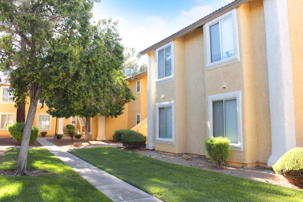 Exterior photo of Sunset Springs apartment Walkway and Building 2